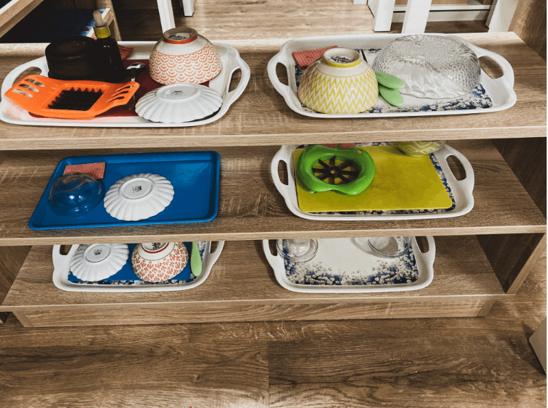 montessori trays on montessori shelving