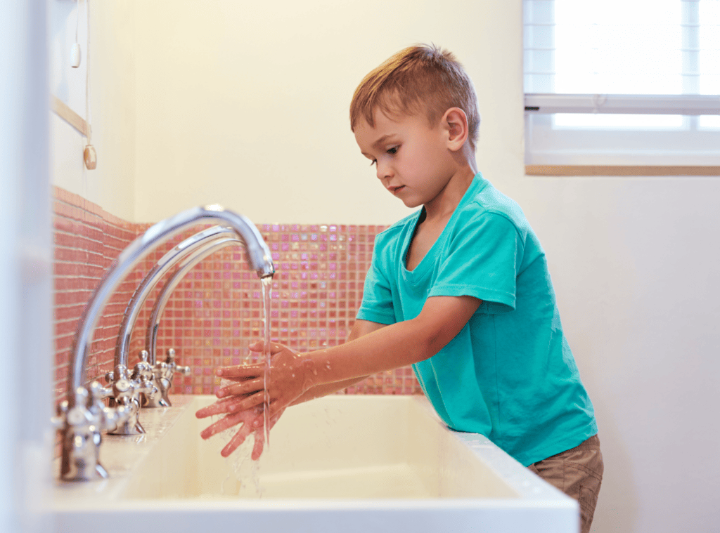 practical life montessori boy washing hands